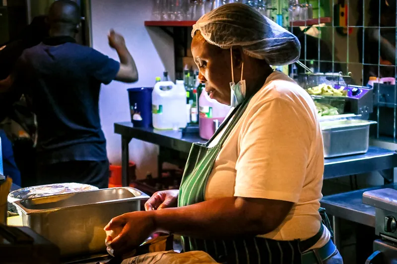 A chef at work on the line in the kitchen